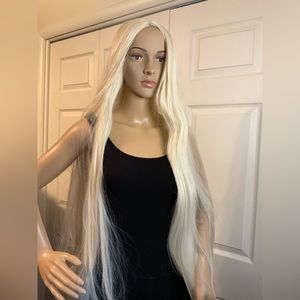 Very long blonde synthetic wig. Great for cosplay, Halloween or every day.